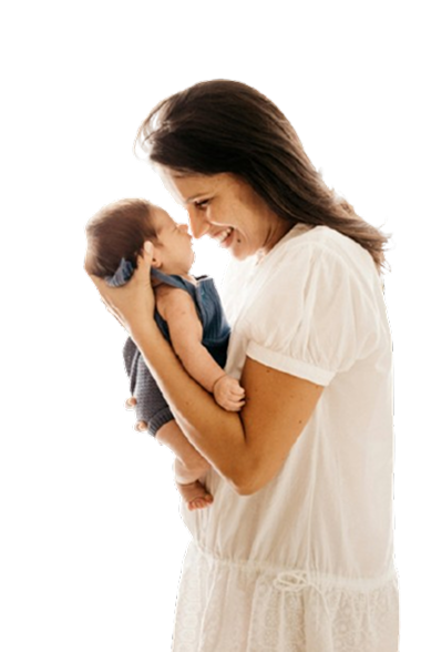 Mother holding and smiling at her baby